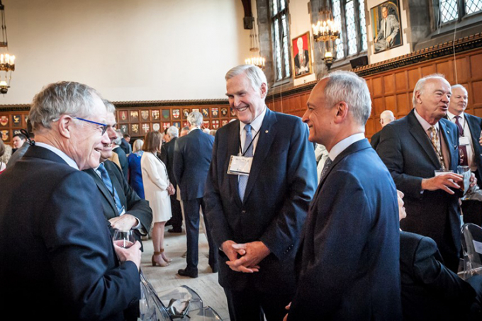 U of T Chancellor Michael Wilson greeted guests at a tribute to his service in May 2018, including leaders from U of T such as Bruce Kidd (left), vice-president of U of T and principal of U of T Scarborough. Photo by Lisa Sakulensky.