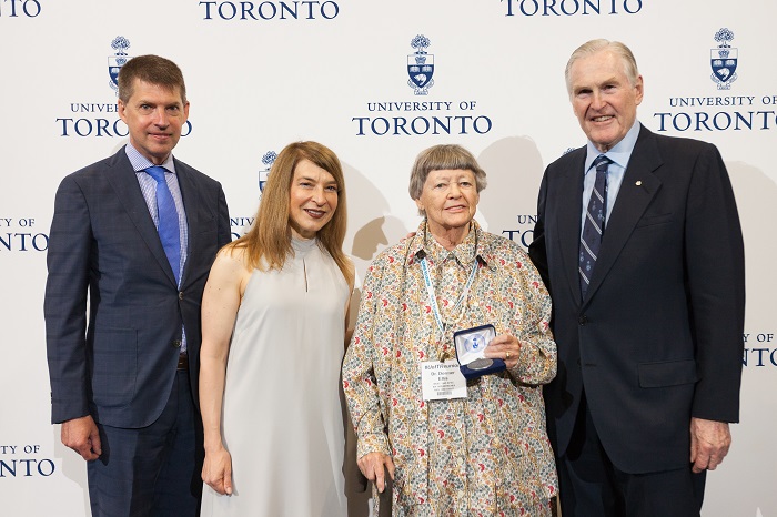 Five time U of T graduate Dr. Dormer Ellis celebrating her special anniversaries with Tye Farrow, Barbara Dick and Chancellor Michael Wilson. Photo by Gustavo Toledo.