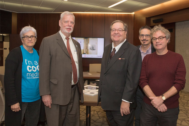 From left: Wendy Duff, dean of U of T's Faculty of Information, Larry Alford, Guy Berthiaume, Robert Fisher of Library and Archives Canada, and John Shoesmith, U of T librarian, at the UNESCO announcement event. Photo by Romi Levine.