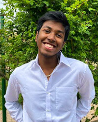 Portrait of Benjamin Koshy Jacob smiling.