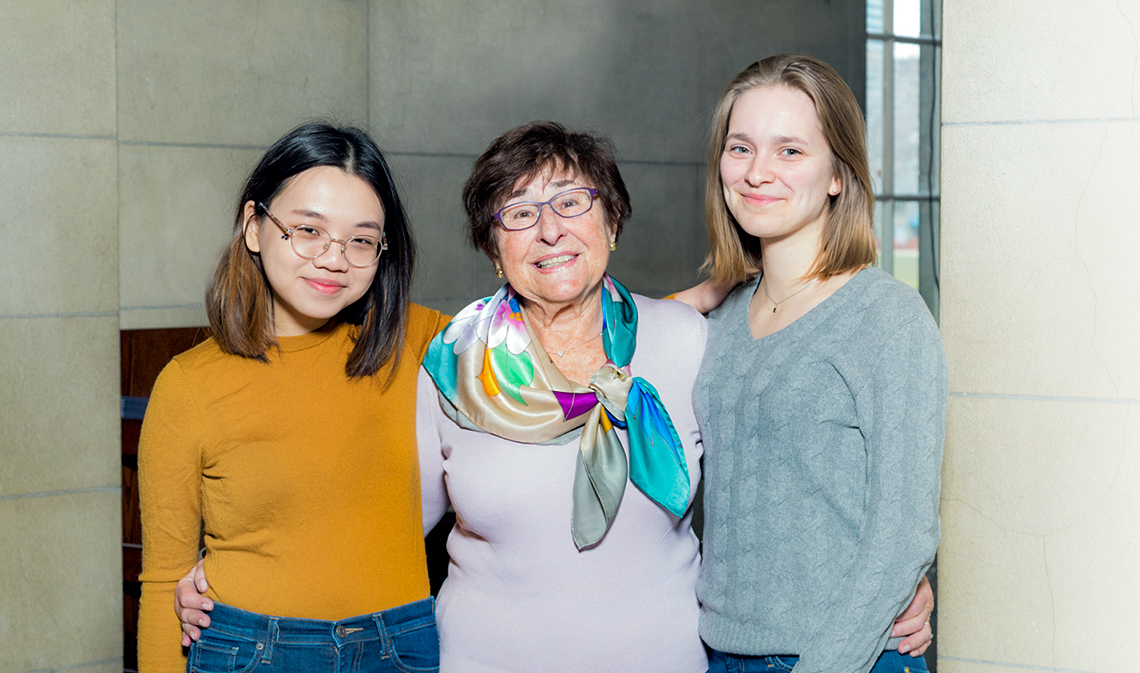 From left: Katie Kwang, Judith Schurek and Katharina Vrolijk smiling and facing camera in a building interior.