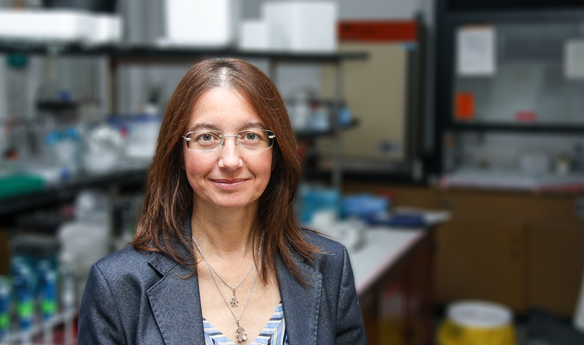 Elena Comelli smiling in lab.